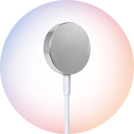 A sleek, round metallic wireless charger with a white cable.